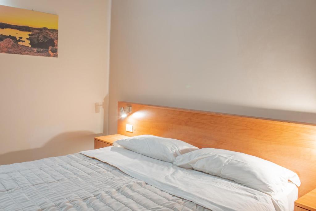 Postel nebo postele na pokoji v ubytování Porta delle Botteghelle