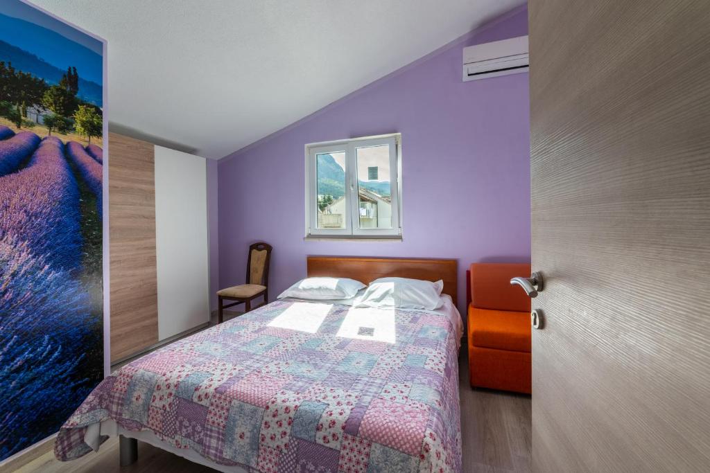 Posteľ alebo postele v izbe v ubytovaní Apartments Ribarević
