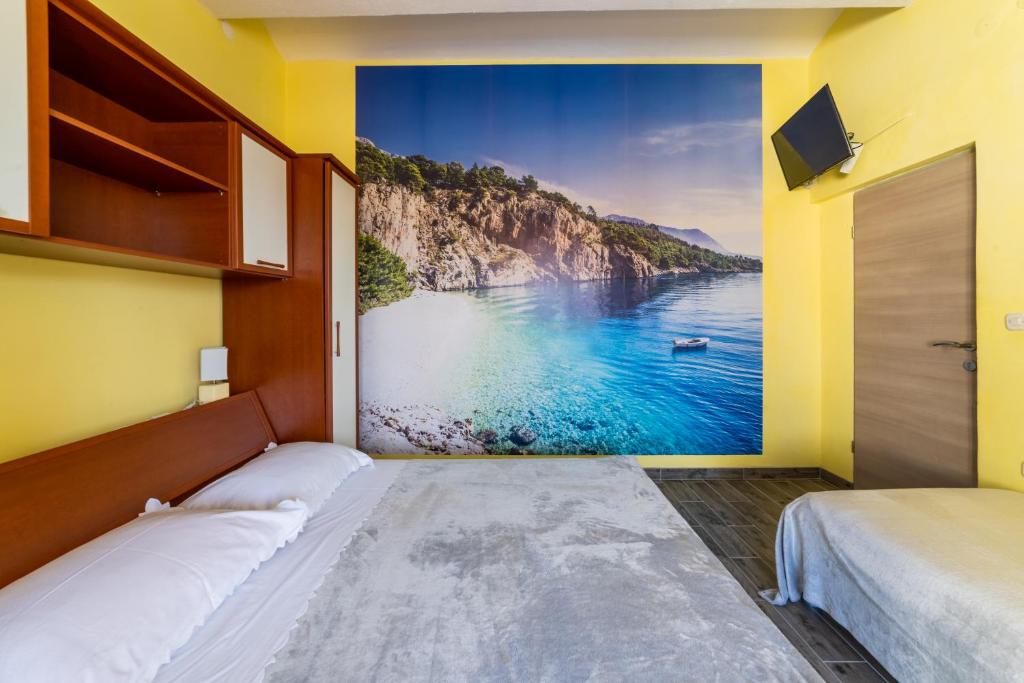 Posteľ alebo postele v izbe v ubytovaní Apartments Ribarević