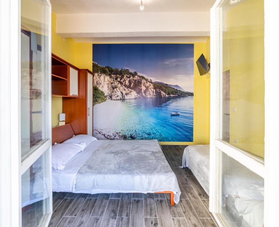Posteľ alebo postele v izbe v ubytovaní Apartments Ribarević