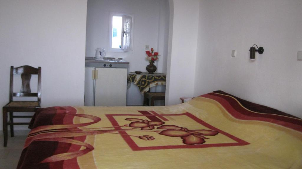 Postel nebo postele na pokoji v ubytování Aronis Plaka Naxos