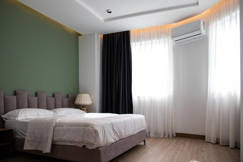 Llit o llits en una habitació de Hotel Blini