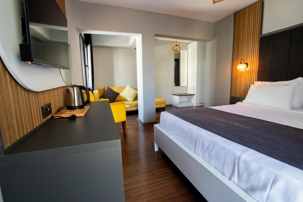 Säng eller sängar i ett rum på Rodis Hotel