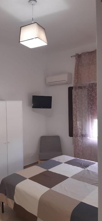 Postel nebo postele na pokoji v ubytování Casa Poseidonia - intero alloggio in riva al mare