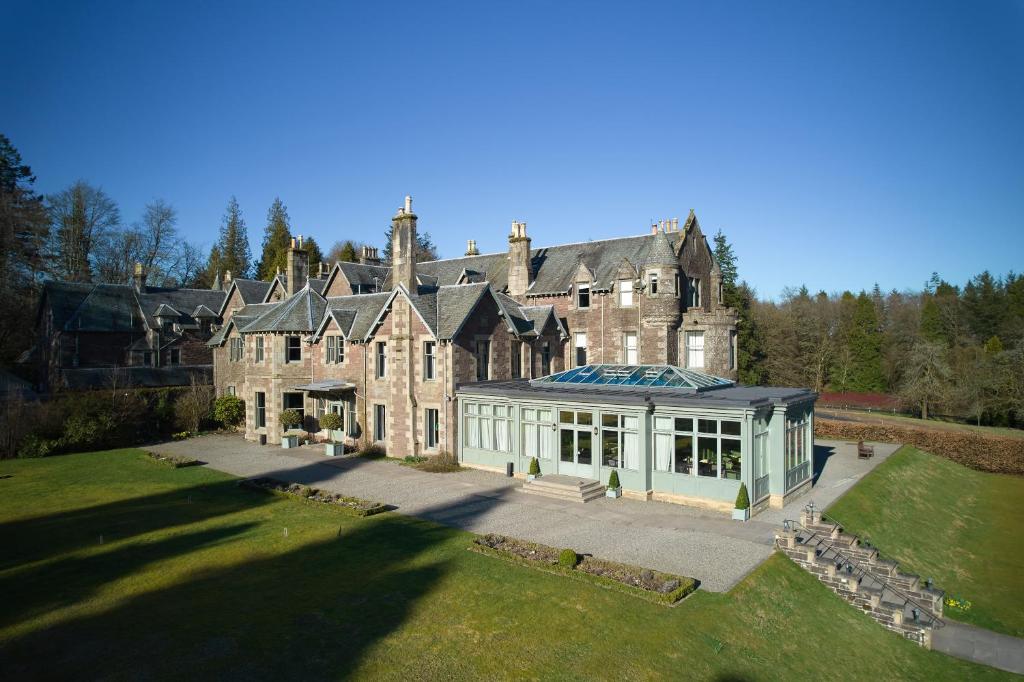 an old house with a large building with a glass at Cromlix in Kinbuck