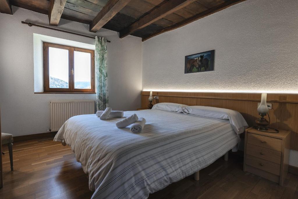 Postel nebo postele na pokoji v ubytování Hostal Etxeberri