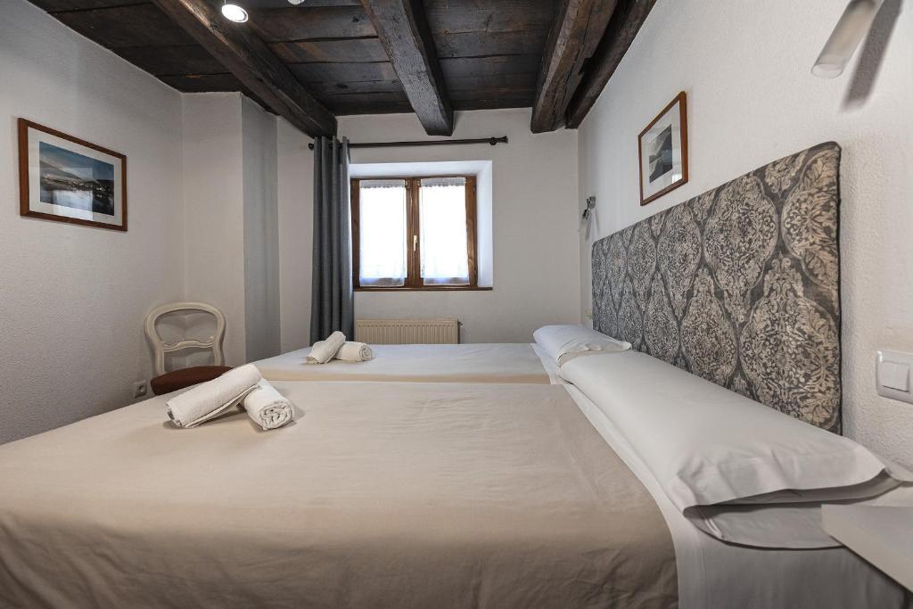 Postel nebo postele na pokoji v ubytování Hostal Etxeberri