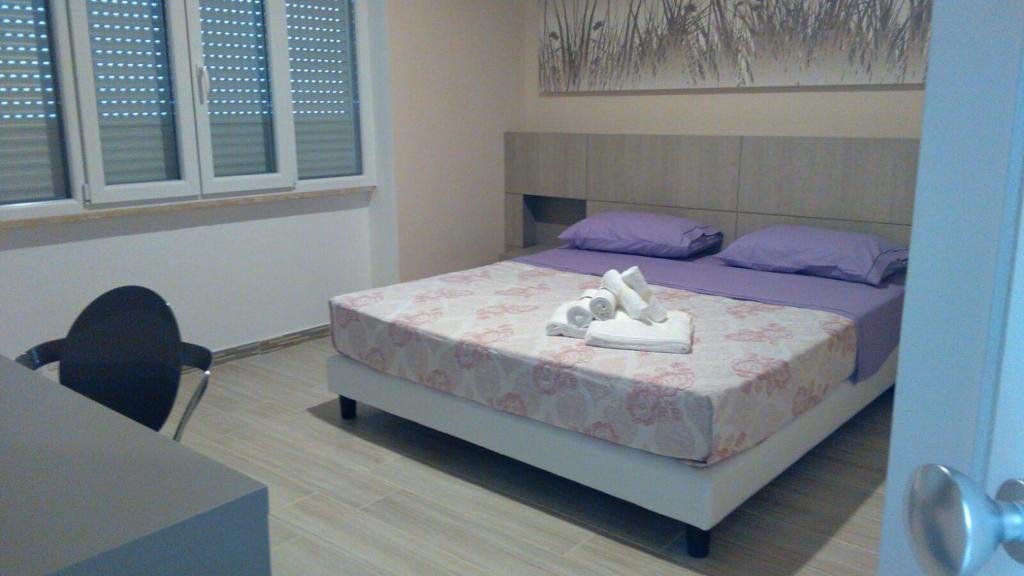 Postel nebo postele na pokoji v ubytování La Terrazza sul mare