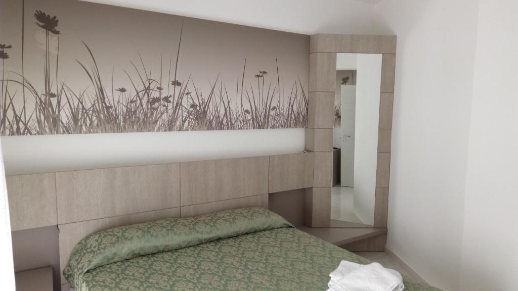 Postel nebo postele na pokoji v ubytování La Terrazza sul mare