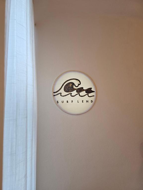a sign on a wall that says suneland at surf.Lend in Graz