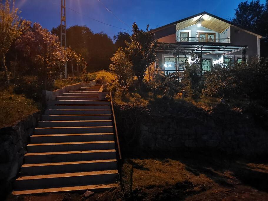 a set of stairs leading to a house at night at Said Paradise in Akcaabat