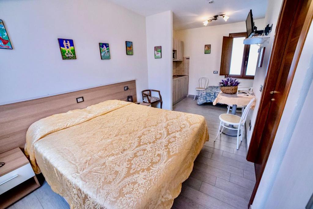 Postel nebo postele na pokoji v ubytování Residence Le stanze dei Visconti