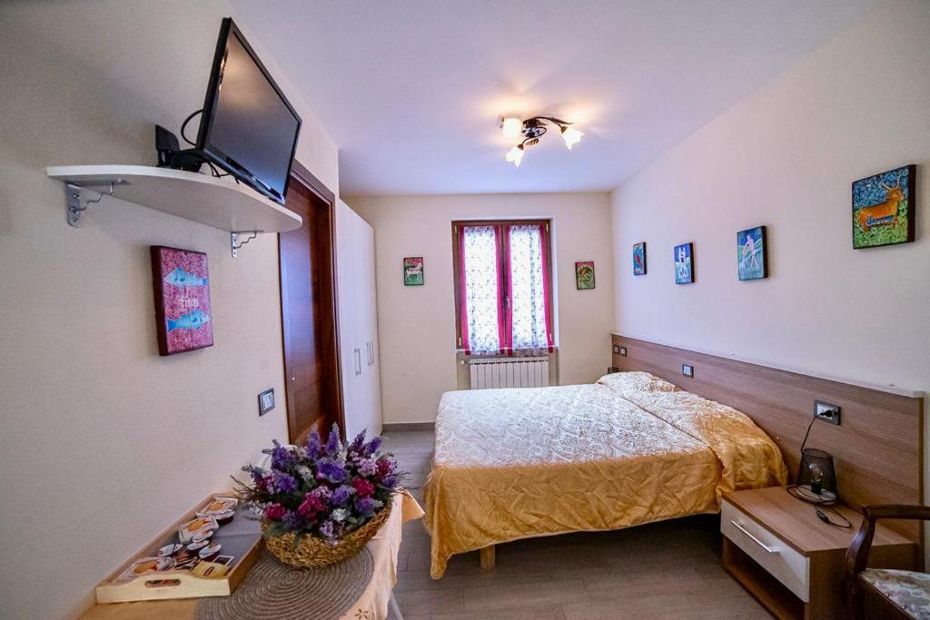 Postel nebo postele na pokoji v ubytování Residence Le stanze dei Visconti