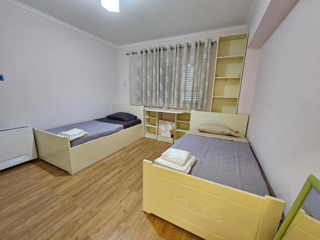 Postel nebo postele na pokoji v ubytování Tirana Central Exclusive