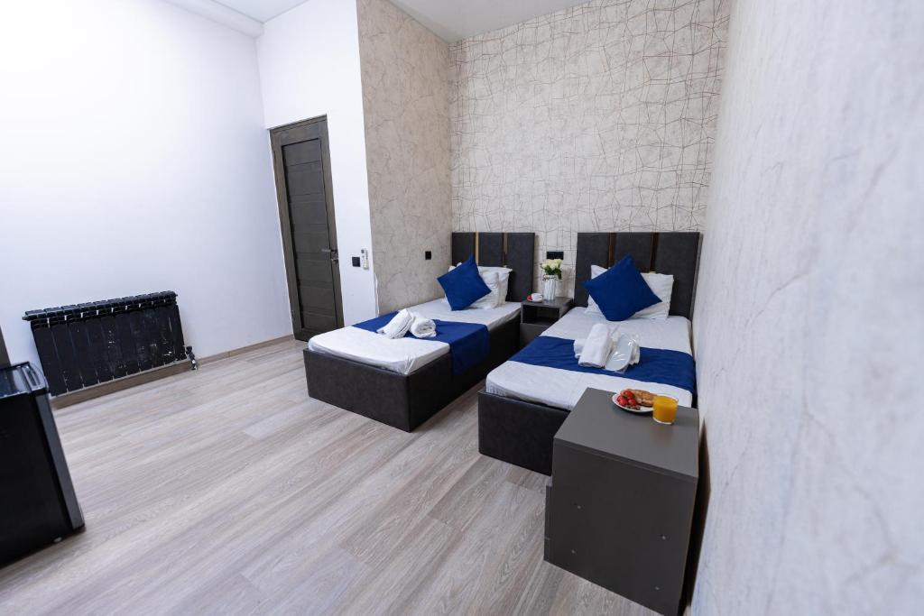 Postel nebo postele na pokoji v ubytování Bloom Hotel Yerevan