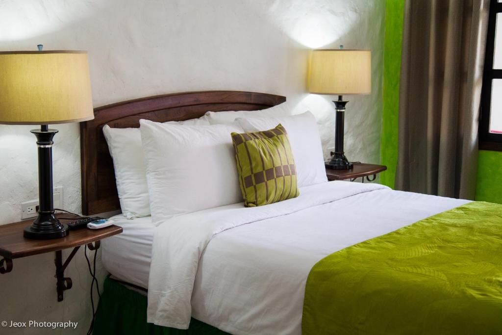 Postel nebo postele na pokoji v ubytování Hotel Ciudad Blanca