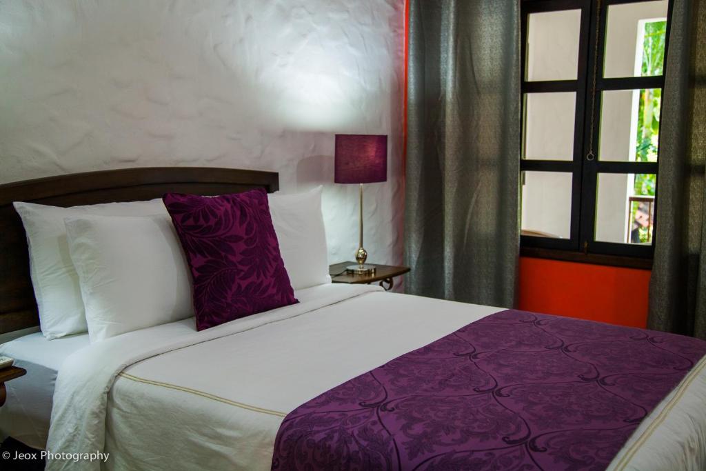 Postel nebo postele na pokoji v ubytování Hotel Ciudad Blanca