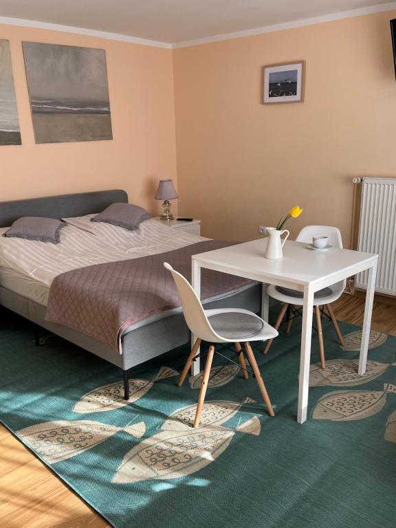 Postel nebo postele na pokoji v ubytování Pensjonat Victoria