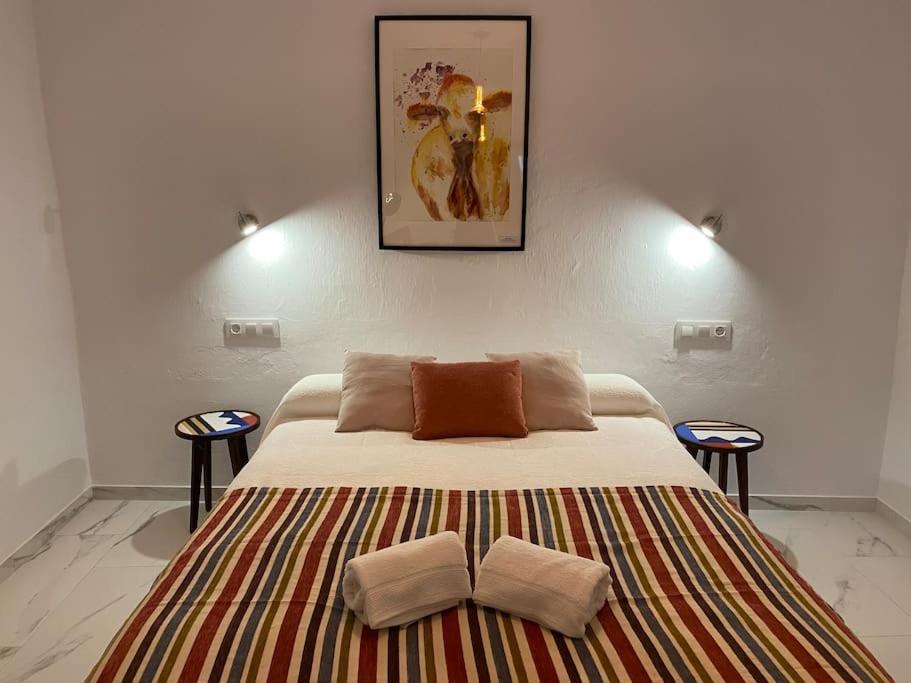 Кровать или кровати в номере Casa Galería La Retinta
