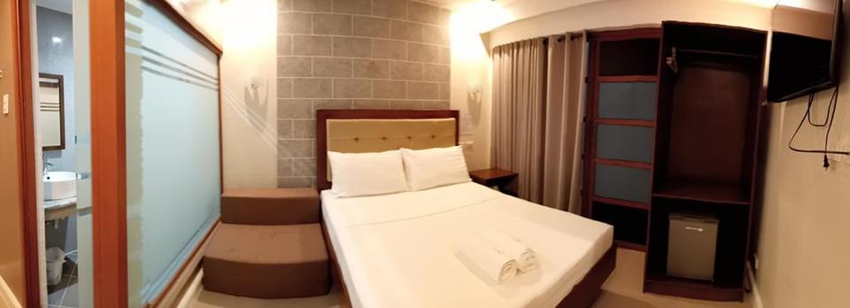 Postel nebo postele na pokoji v ubytování Panglao Alona Suites
