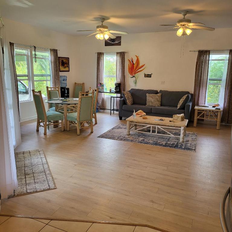 a living room with a couch and a table at Hoomaikai Blessings in Keaau