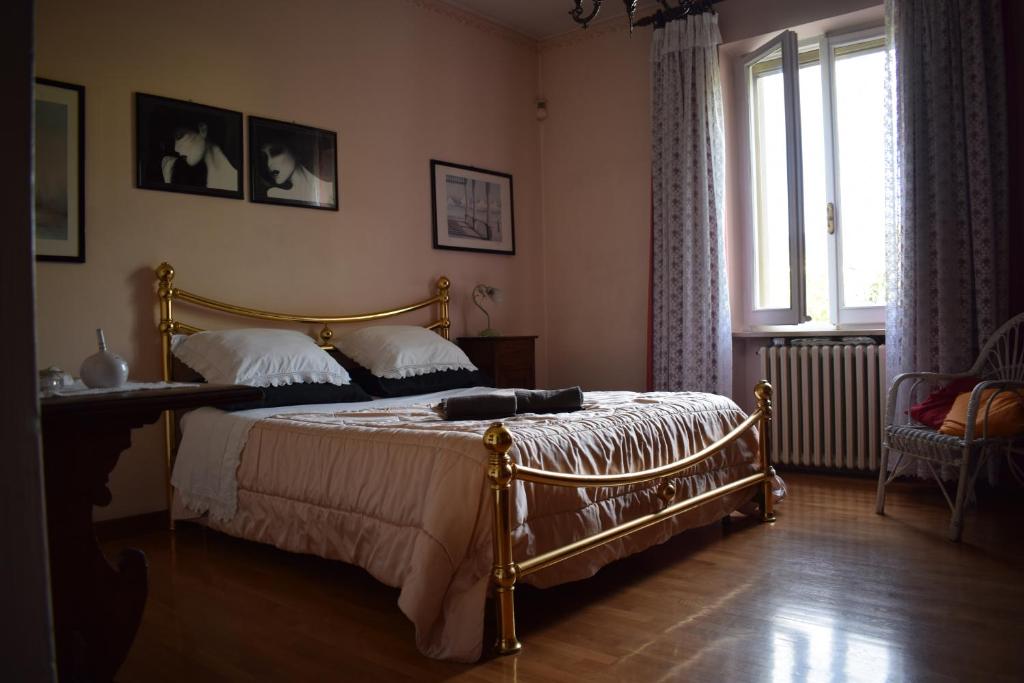 Säng eller sängar i ett rum på La casa di ViSi