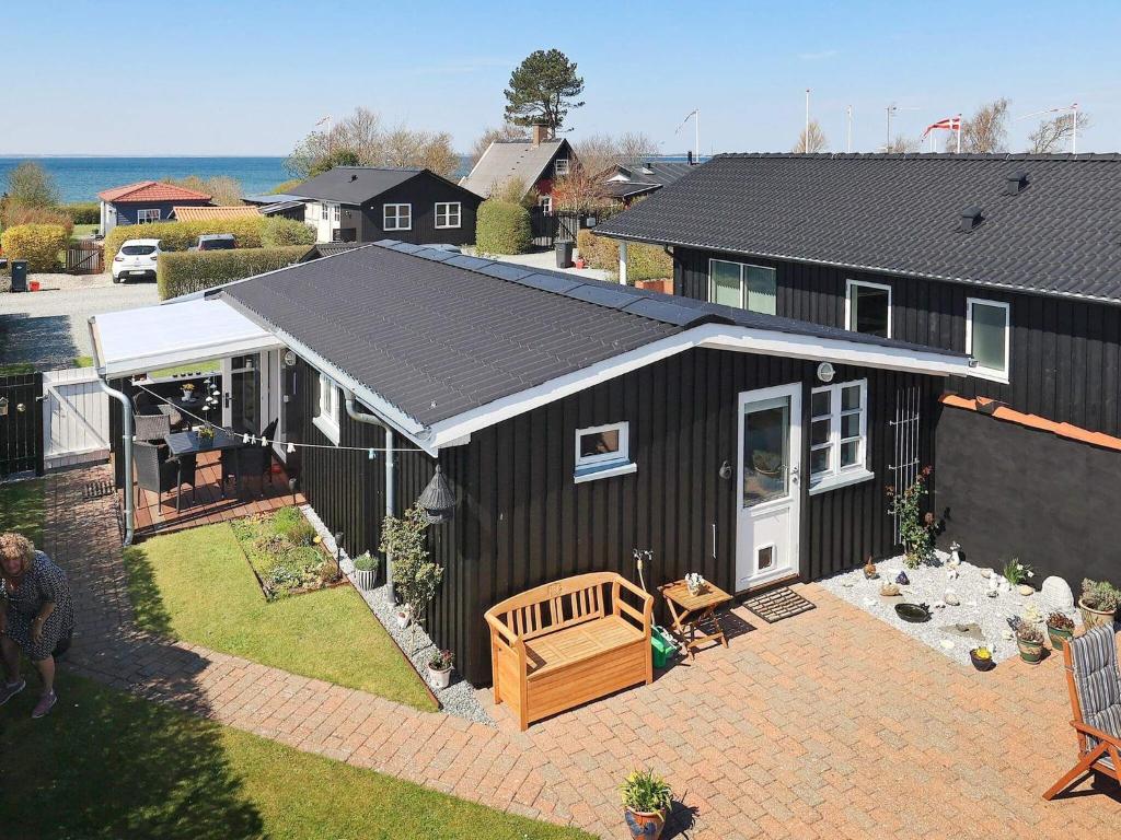 an overhead view of a black house with a patio at Holiday home Assens VI in Assens