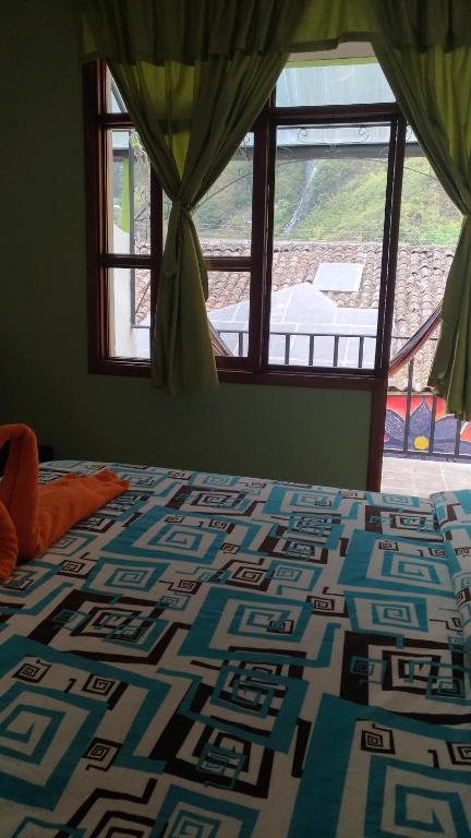 Postel nebo postele na pokoji v ubytování Hostal & Spa Casa Real