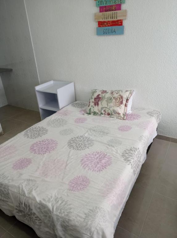 Postel nebo postele na pokoji v ubytování Hotel Bogotá Calle 100