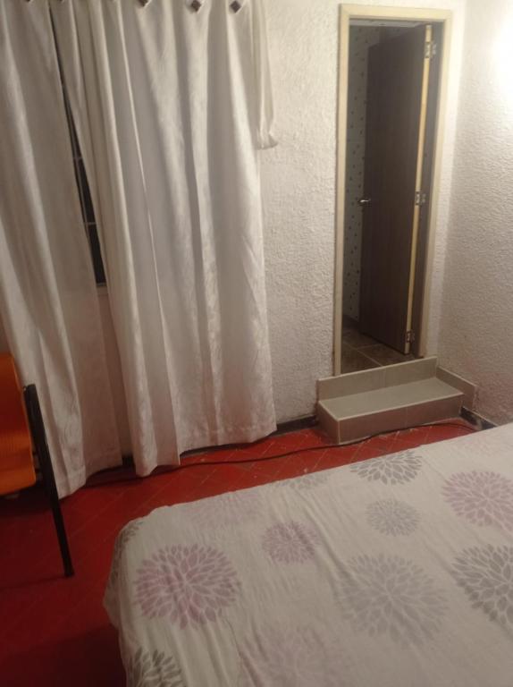 Postel nebo postele na pokoji v ubytování Hotel Bogotá Calle 100