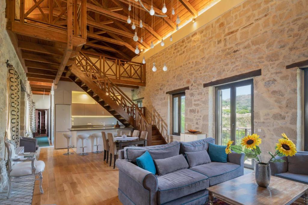 a living room with a couch and a table at Villa Lambraki in Síva