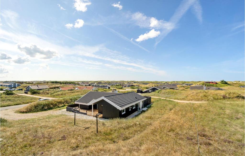 an overhead view of a house in a field at Stunning Home In Hvide Sande With Wifi in Bjerregård