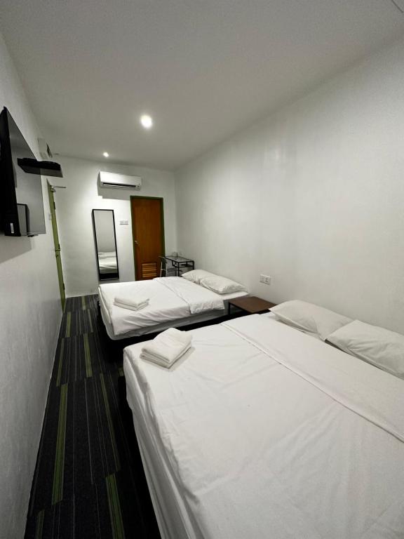 Postel nebo postele na pokoji v ubytování Olive Bedz Hotel