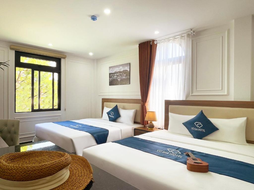 Кровать или кровати в номере Vu Gia Hotel Dalat