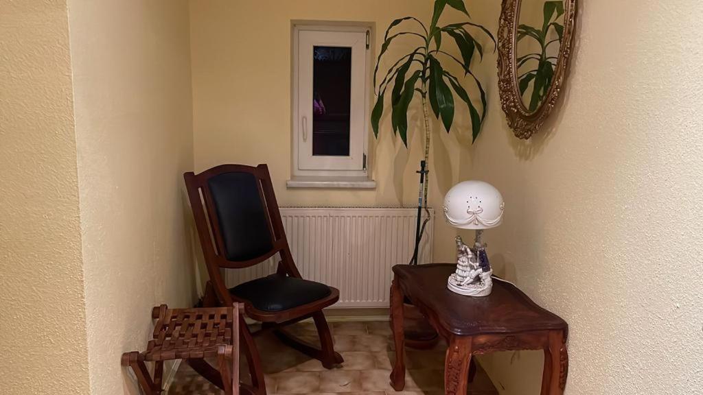 a room with two chairs and a table with a lamp at FreiNestWaldviertel in Hoheneich