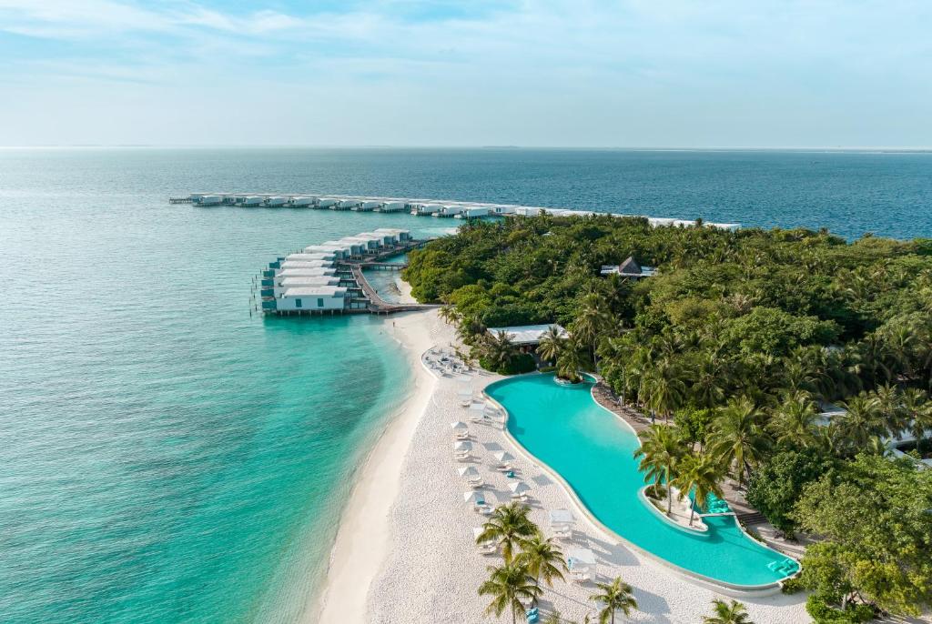 an aerial view of the beach at the resort at Amilla Maldives in Kihaadhoo