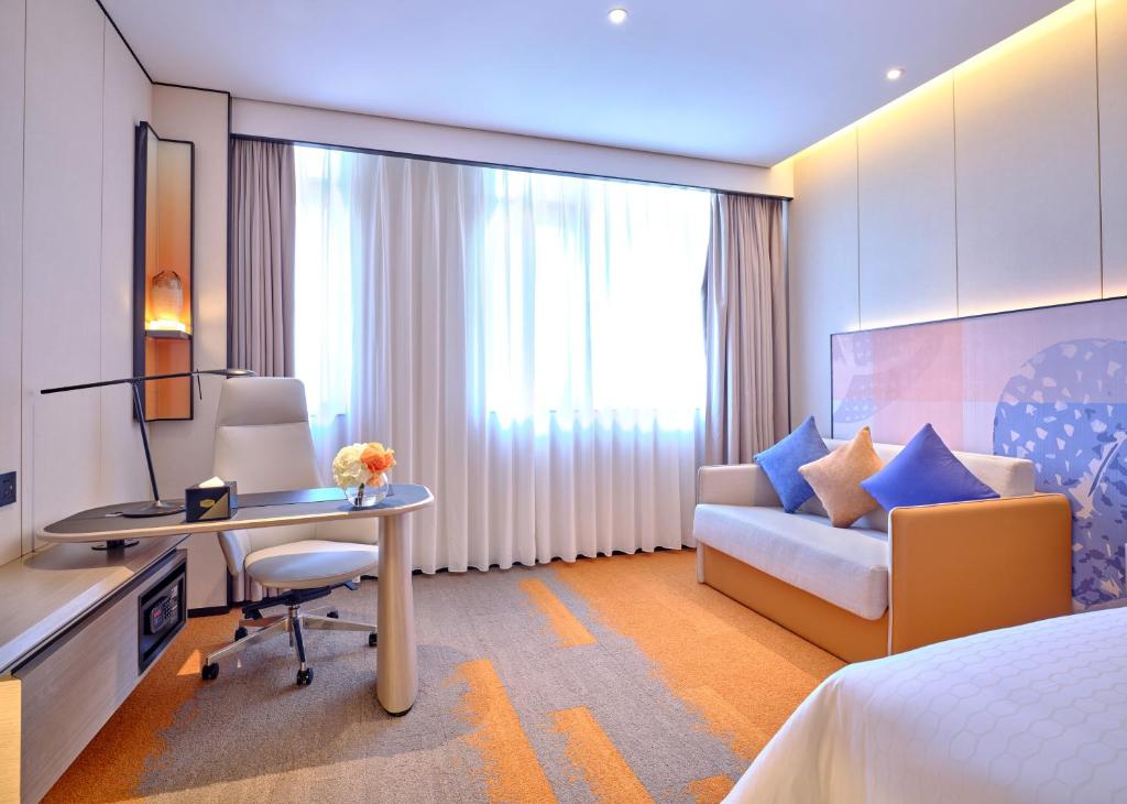 TV a/nebo společenská místnost v ubytování Hampton by Hilton Shenzhen North Station