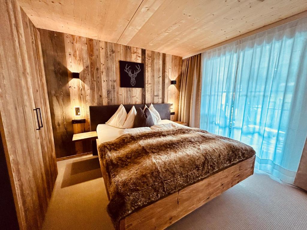 Postel nebo postele na pokoji v ubytování Sonn-Alm Chalet-Apartments