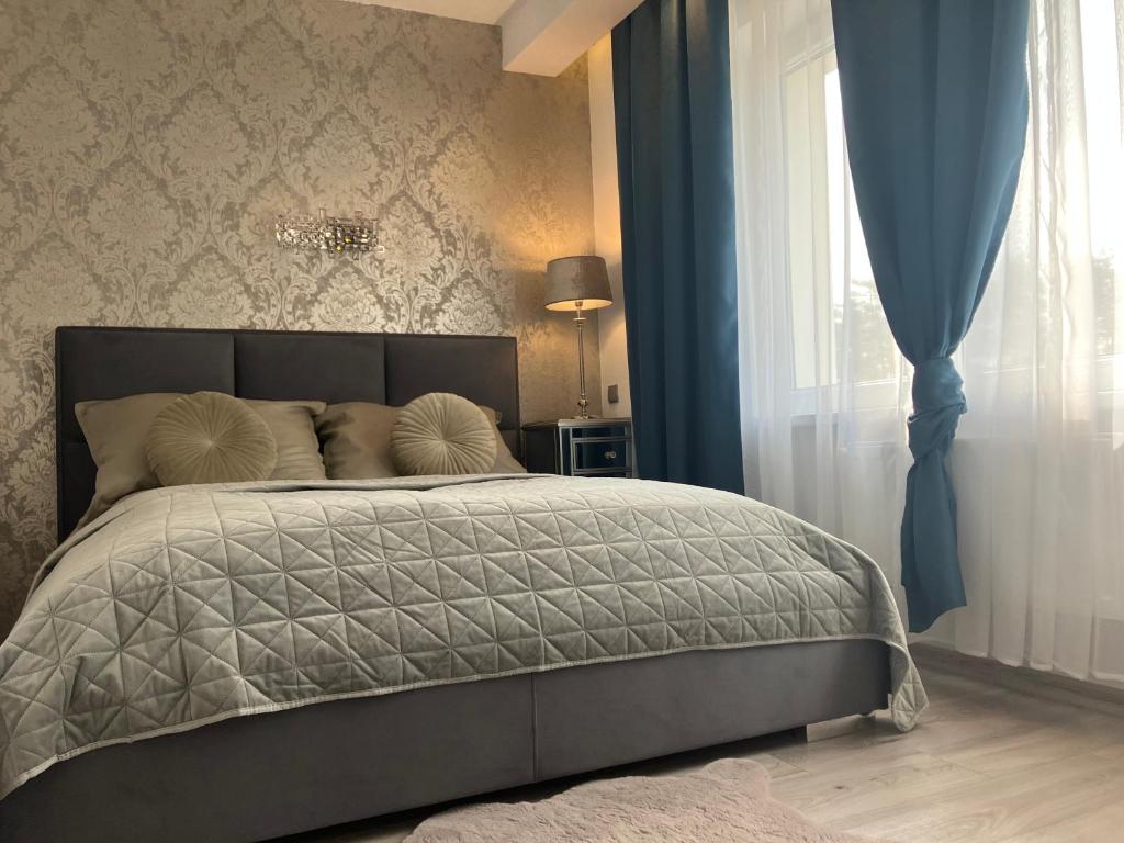 Posteľ alebo postele v izbe v ubytovaní Apartamenty Arkadia