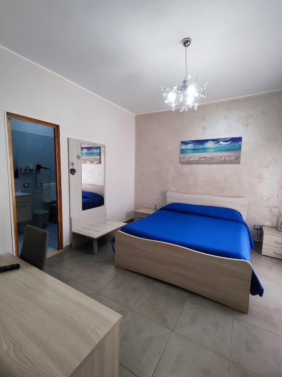 Postel nebo postele na pokoji v ubytování Albergo Primavera