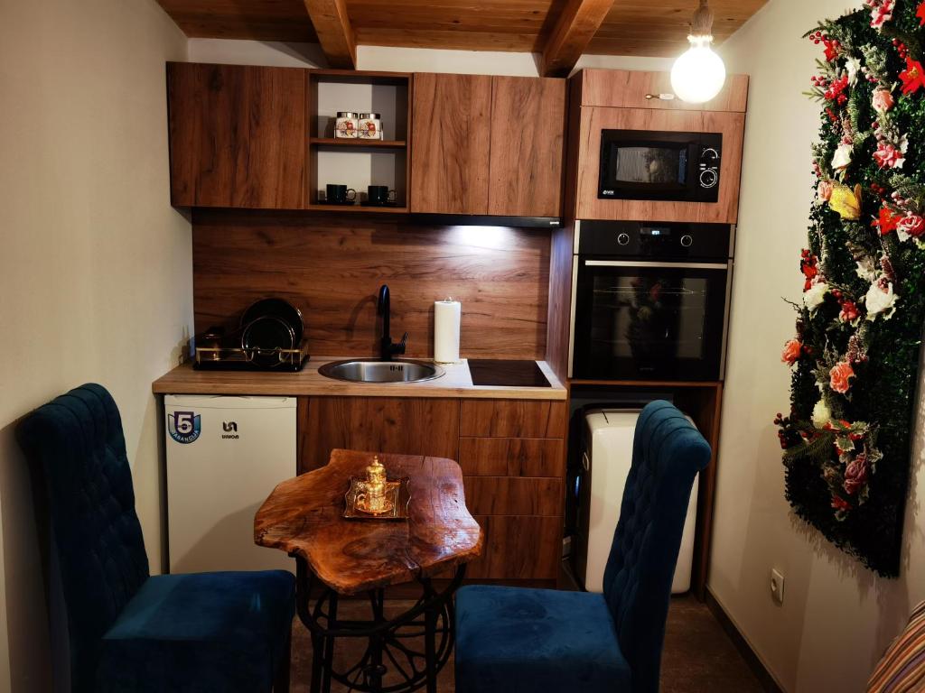 Kuchyň nebo kuchyňský kout v ubytování Odmaraliste Kod Miće Apartman 4