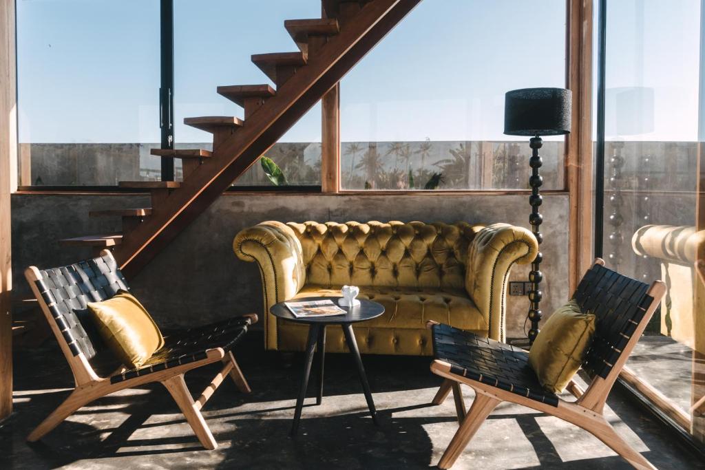 a living room with a couch and two chairs at DABA - Designer Villas in Perenenan - Beach 600M in Canggu