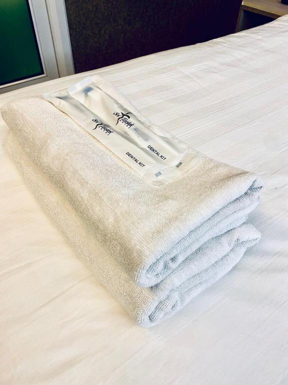 Postel nebo postele na pokoji v ubytování Sri Langit Hotel KLIA, KLIA 2 & F1