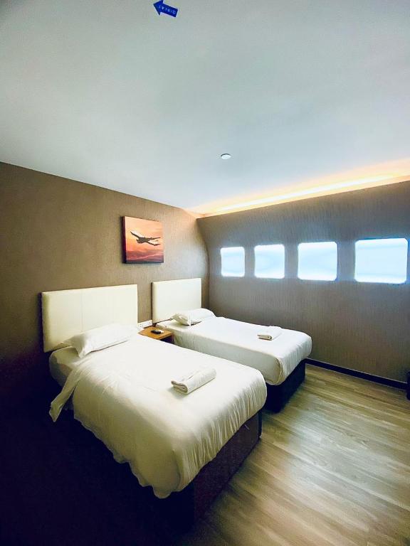 Postel nebo postele na pokoji v ubytování Sri Langit Hotel KLIA, KLIA 2 & F1