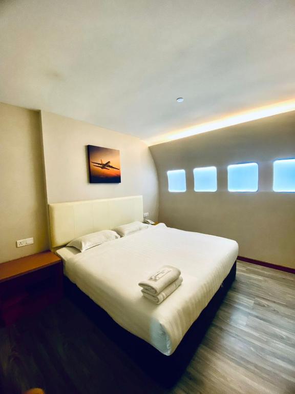 Postel nebo postele na pokoji v ubytování Sri Langit Hotel KLIA, KLIA 2 & F1