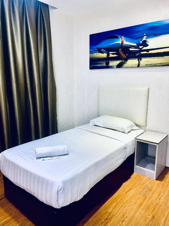 Postel nebo postele na pokoji v ubytování Sri Langit Hotel KLIA, KLIA 2 & F1