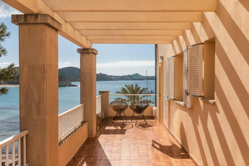 a balcony with a view of the water at INNER Niza Paguera in Paguera