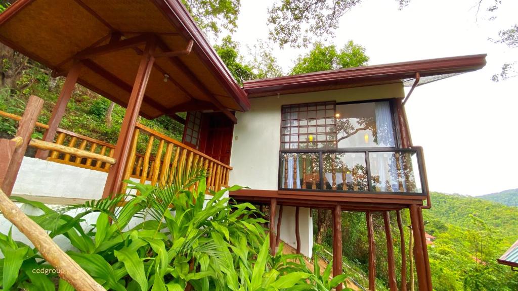 a small house with a window on the side of it at CED Garden in El Nido