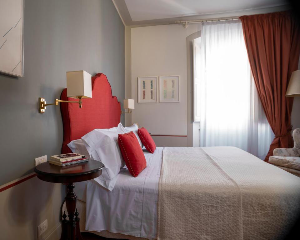 Postel nebo postele na pokoji v ubytování Albergo Pietrasanta