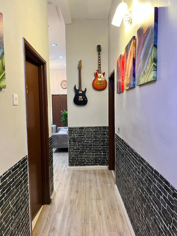 Postel nebo postele na pokoji v ubytování Casa Indah Guest House, Melaka